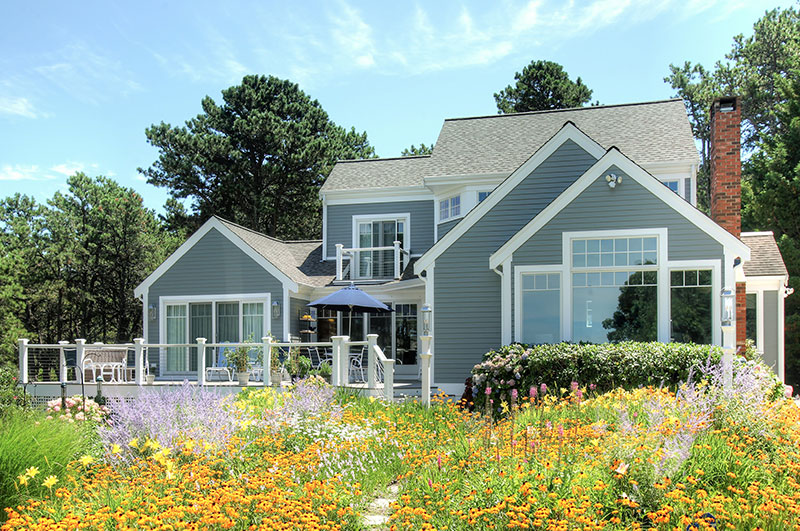 after photo of home with wildflower garden